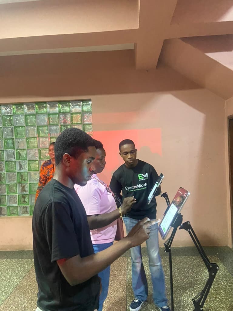 The team assisting a guest at check-in