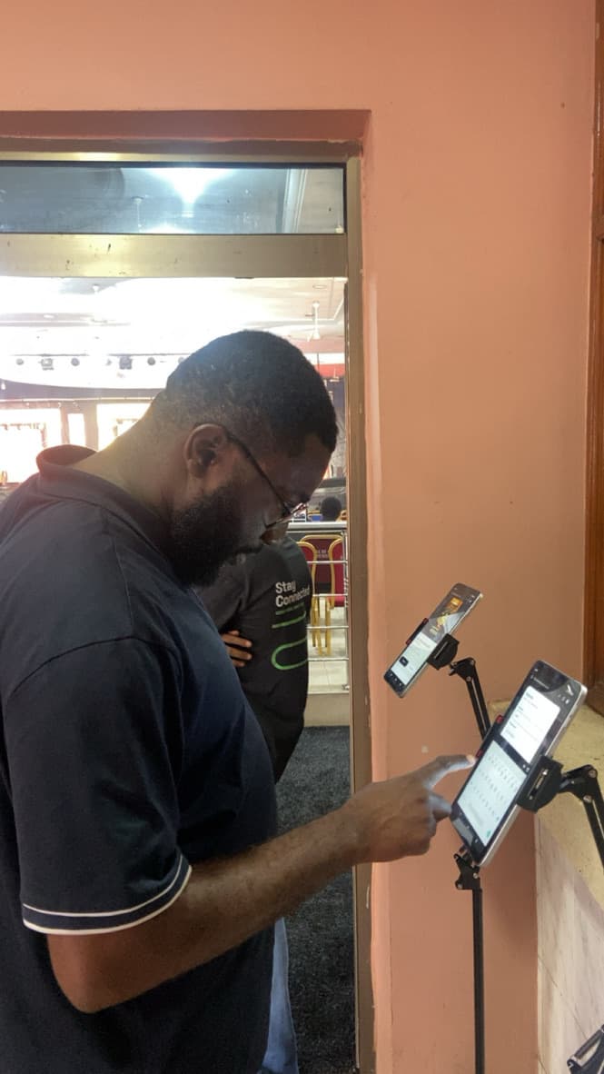 A guest entering details on a tablet